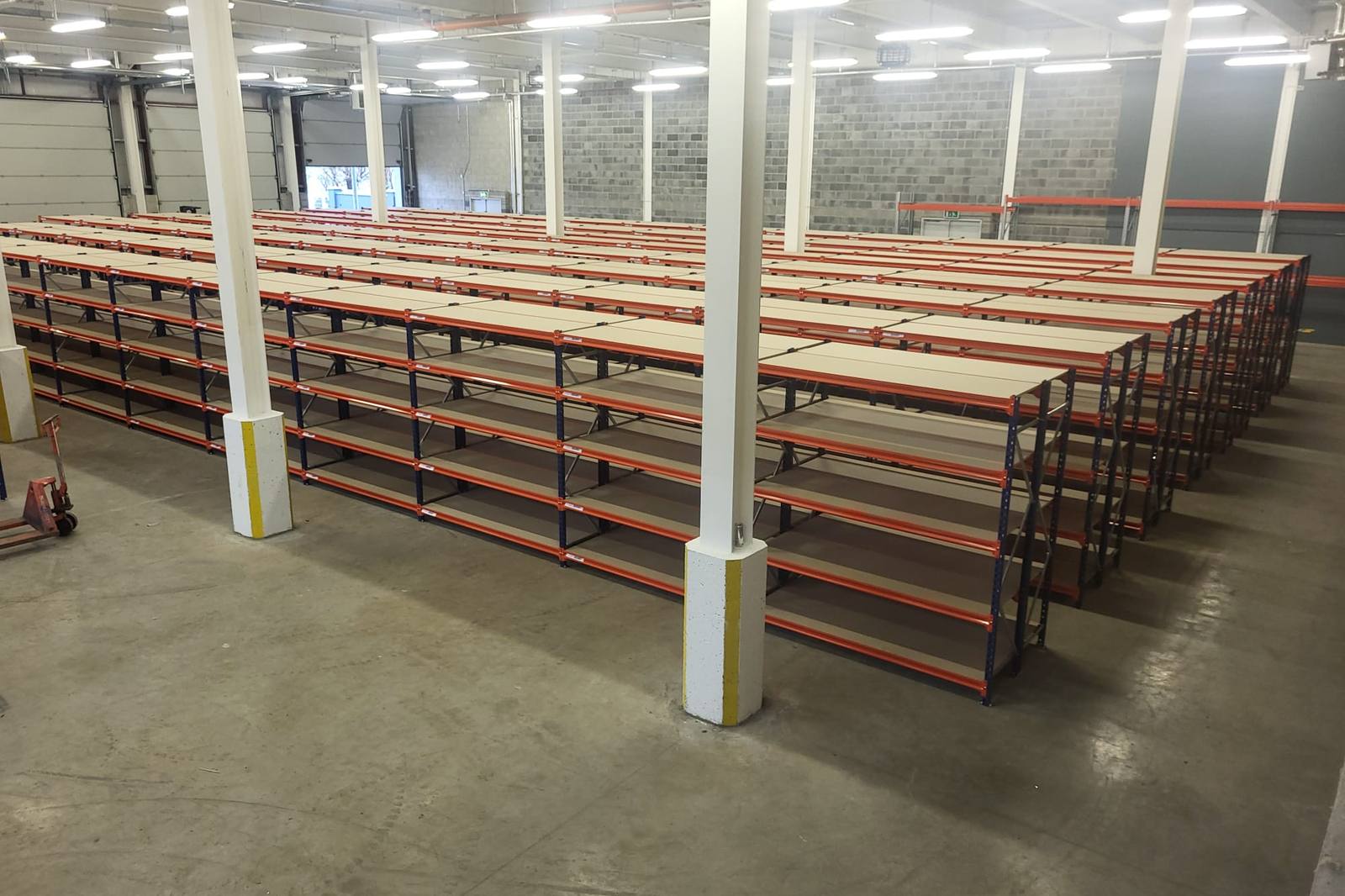 Long span shelving bays with timber levels in the warehouse
